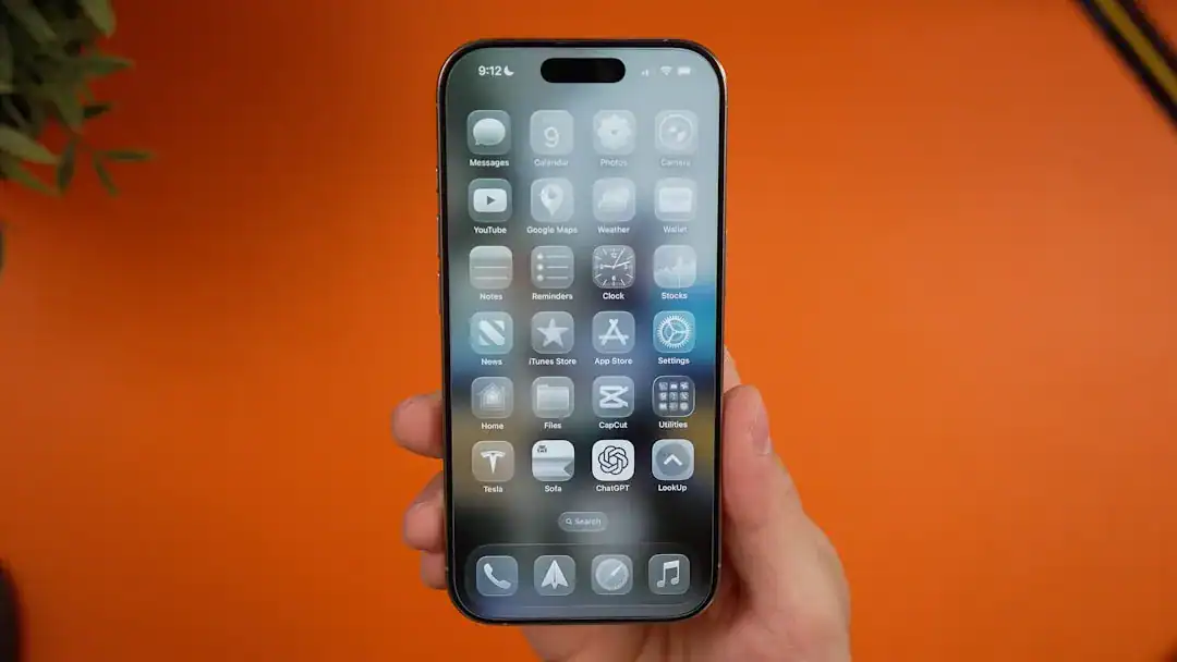 Illustration of A high-quality close-up photography of a modern smartphone screen held in a hand, displaying a grid.