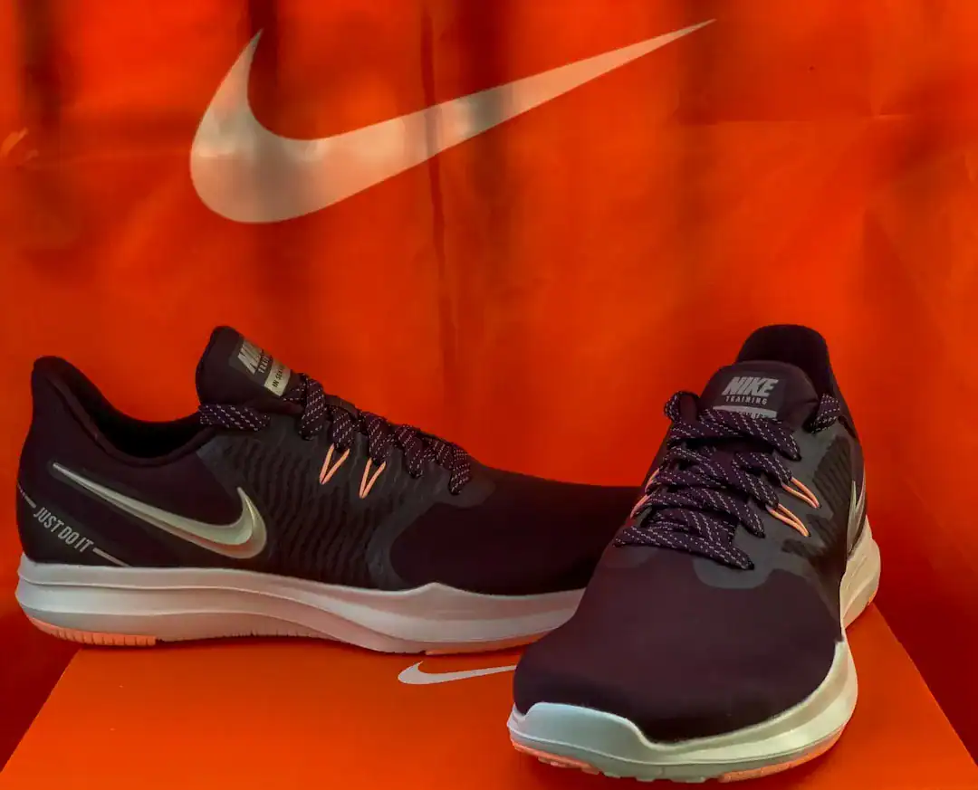 Illustration of Close-up macro photography of the side of a sneaker featuring the iconic curved checkmark shape.