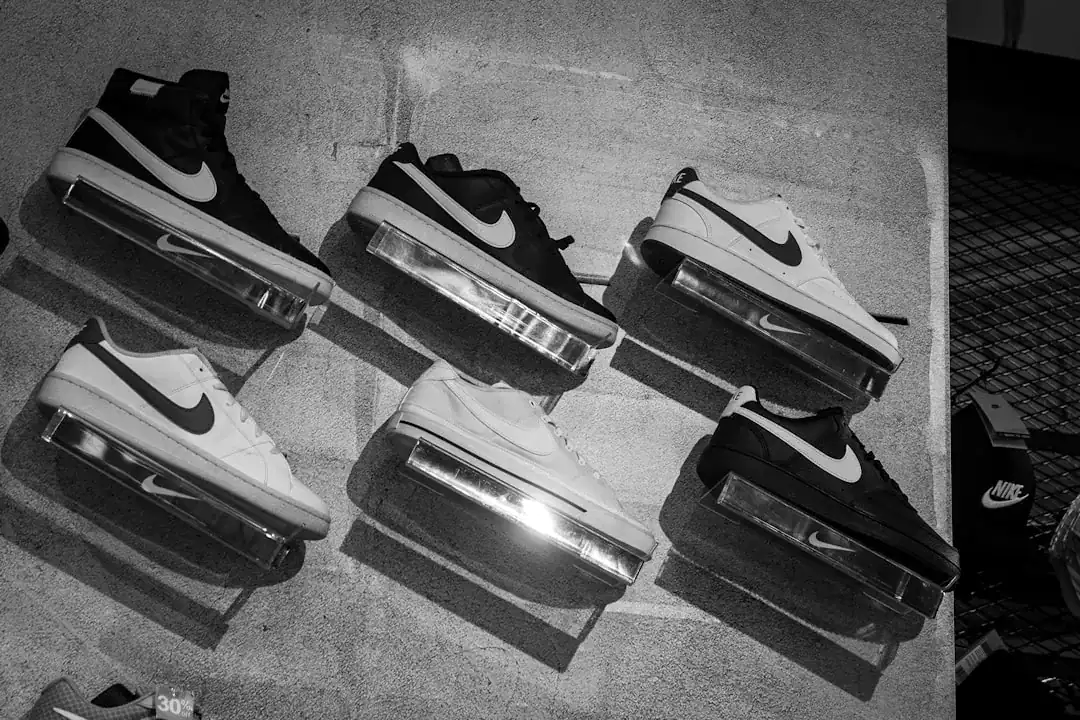 Illustration of Close-up macro photography of a vintage 1972 running shoe made of white leather and nylon,.