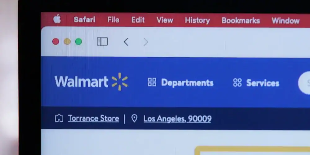 Laptop screen displaying Walmart homepage in Safari browser