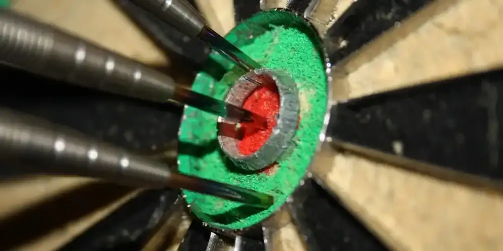 Close-up of darts around the bullseye on a dartboard