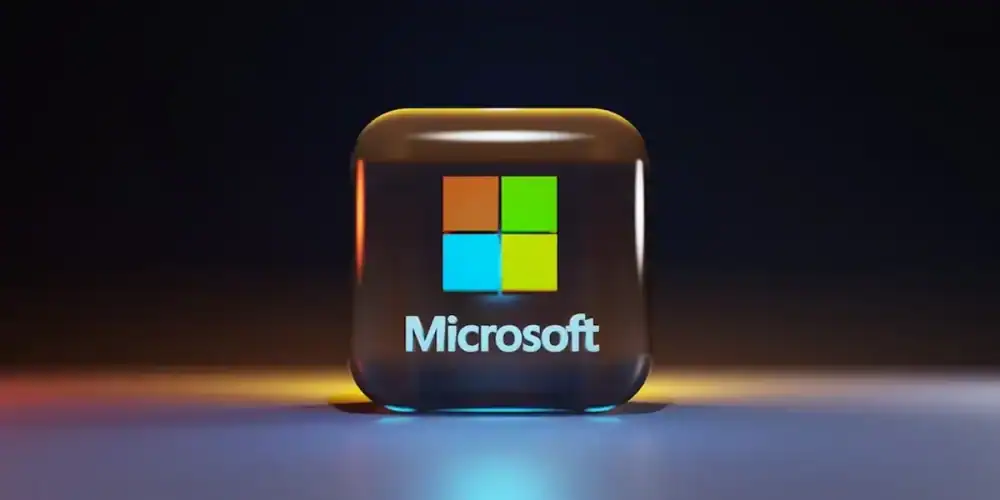 Glowing cube with Microsoft logo on a reflective surface