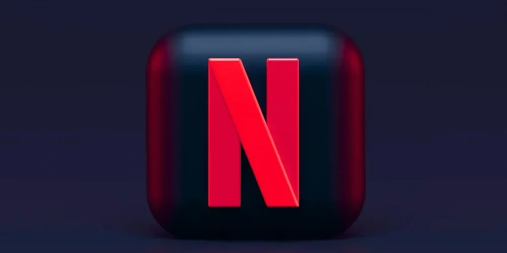 Netflix N logo on a glossy dark square with reflection