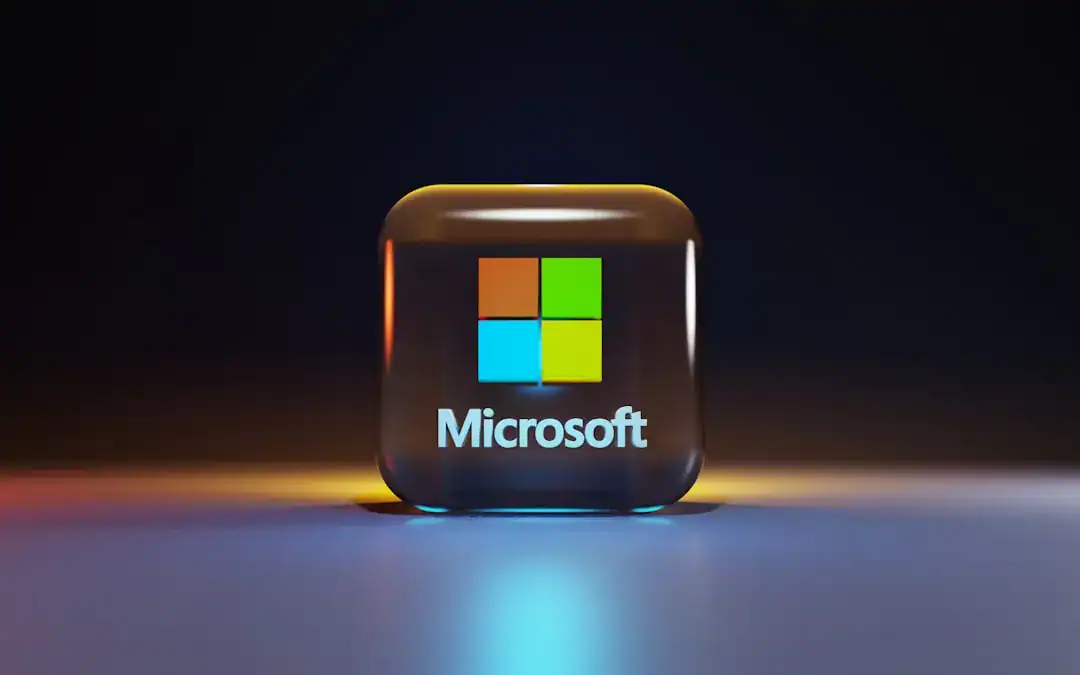 Glowing cube with Microsoft logo on a reflective surface
