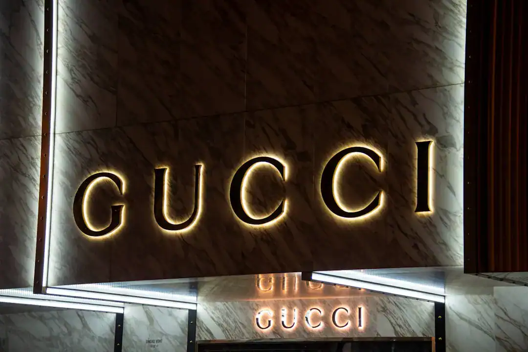 Gucci illuminated logo on marble storefront