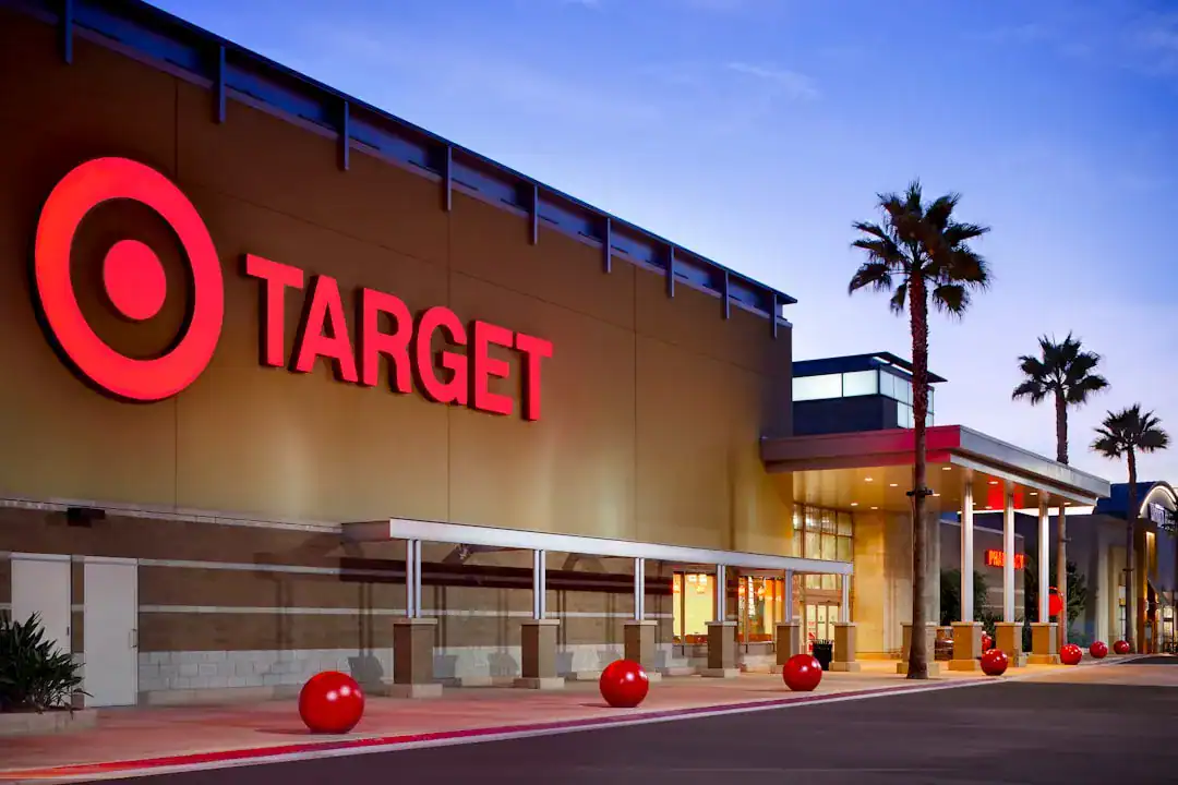 Exterior Target store with logo, palm trees, dusk lighting