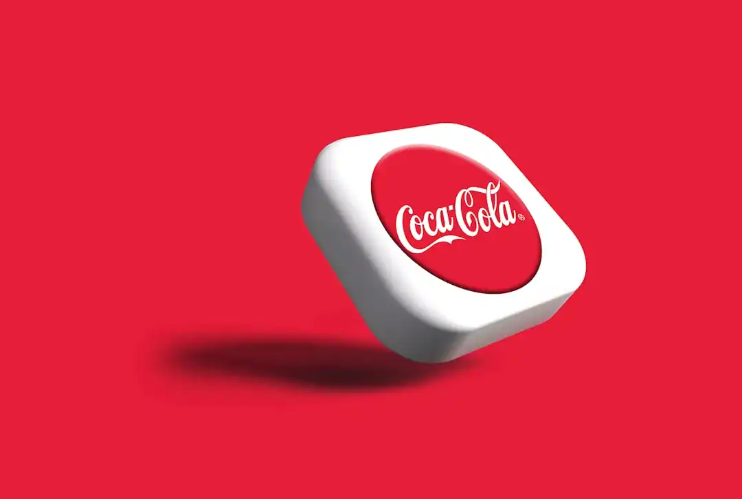 Floating white rounded-square tile with Coca-Cola logo on red background