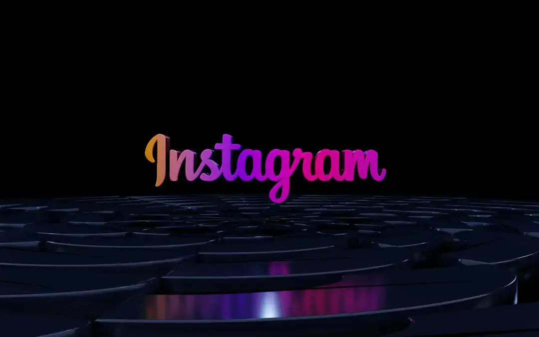 Instagram gradient logo above a reflective dark surface