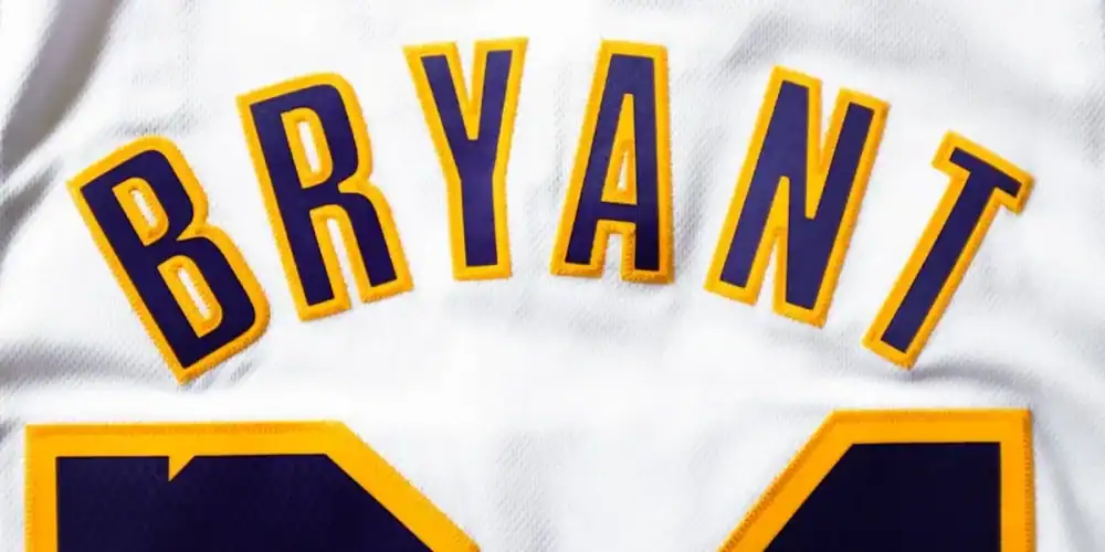 Close-up of a white basketball jersey with BRYANT and the number 24