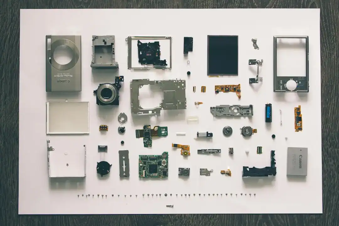 Disassembled electronic device components laid out on a white background