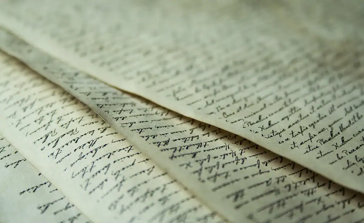 Close-up of cursive handwriting on aged manuscript pages