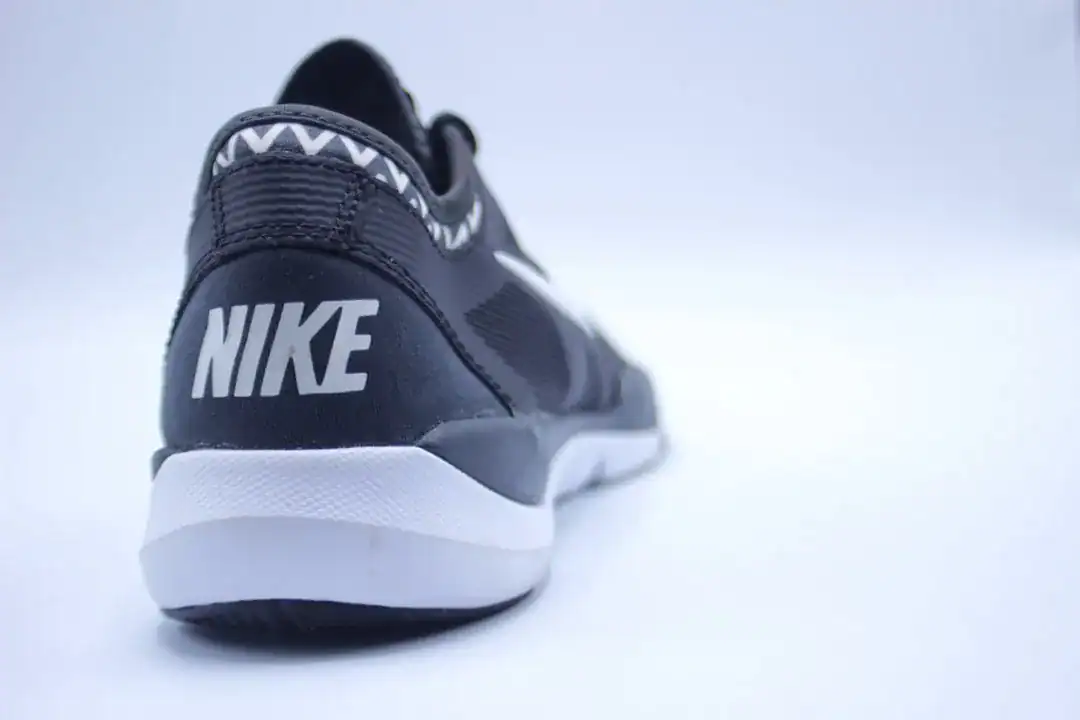 Rear view of a black Nike running shoe with white sole