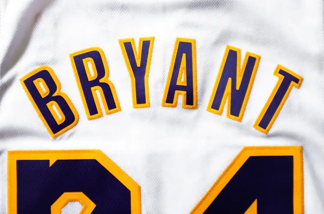 Close-up of a white basketball jersey with BRYANT and the number 24