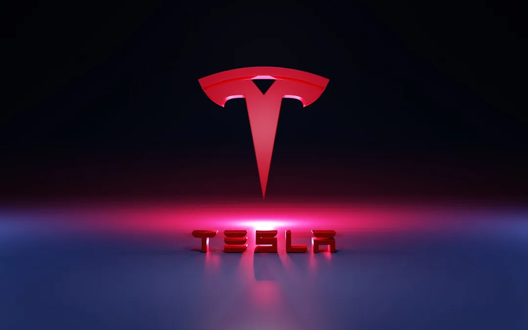 Red 3D Tesla emblem with glowing TESLA wordmark on a reflective surface