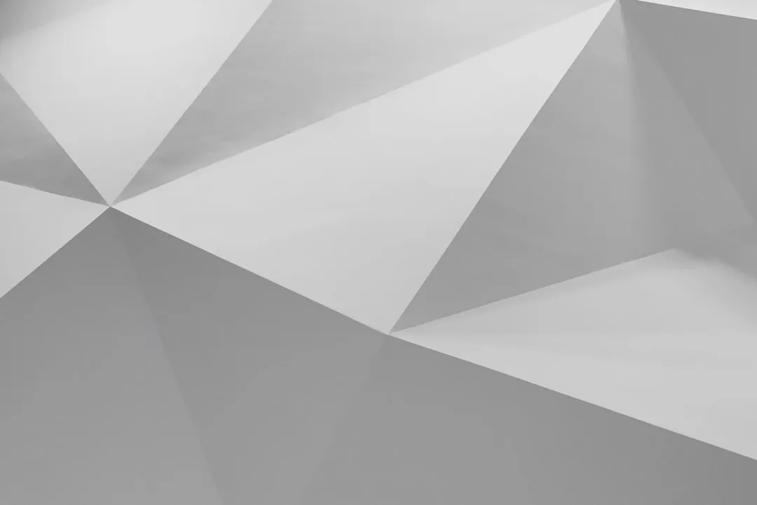 Grayscale Geometric Low-Poly Background Grayscale abstract low-poly geometric background with triangular facets
